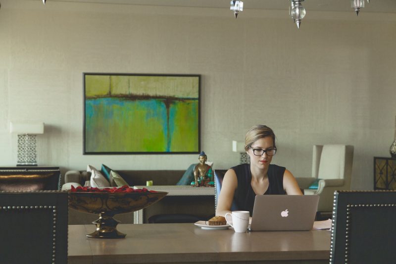 Woman typing with laptop